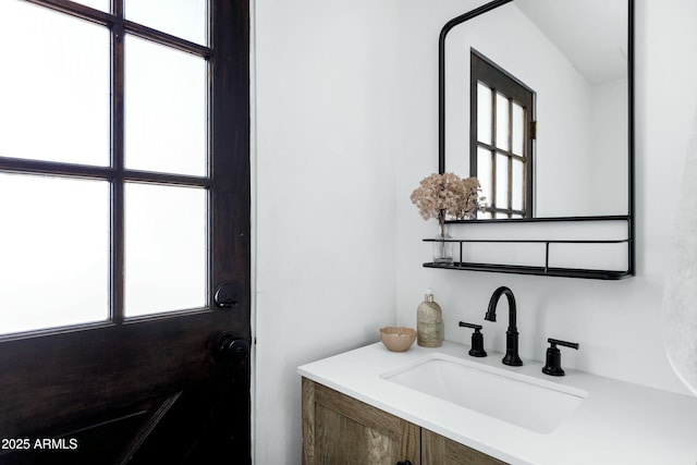 bathroom with a healthy amount of sunlight and vanity