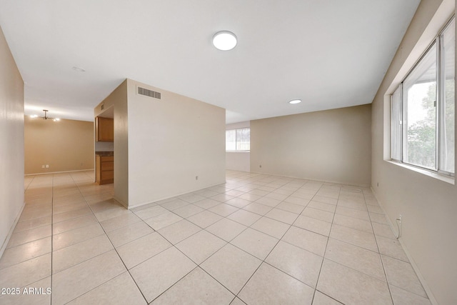 spare room with light tile patterned floors and visible vents