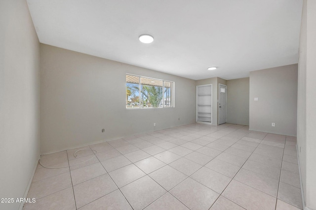 spare room with light tile patterned floors