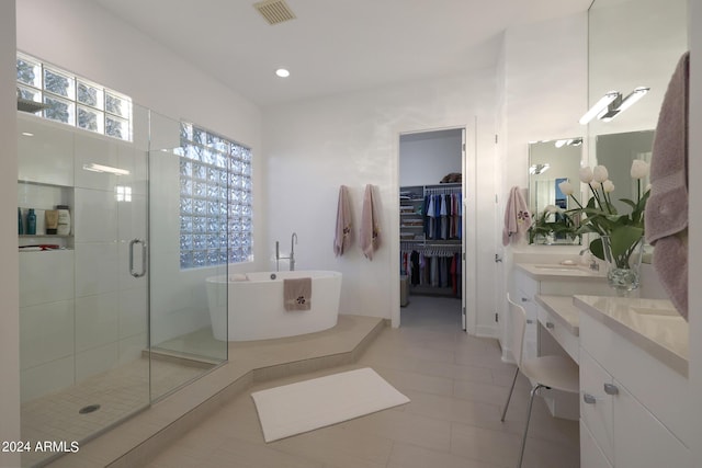 bathroom featuring vanity, tile patterned floors, and independent shower and bath