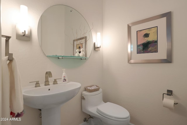 bathroom featuring sink and toilet