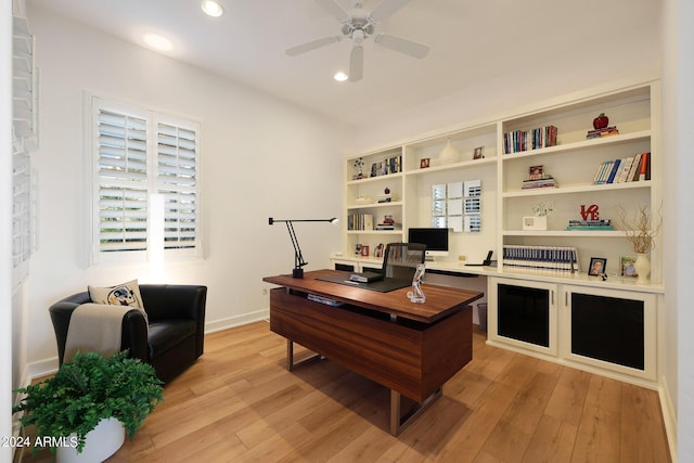 office space with light hardwood / wood-style flooring and ceiling fan