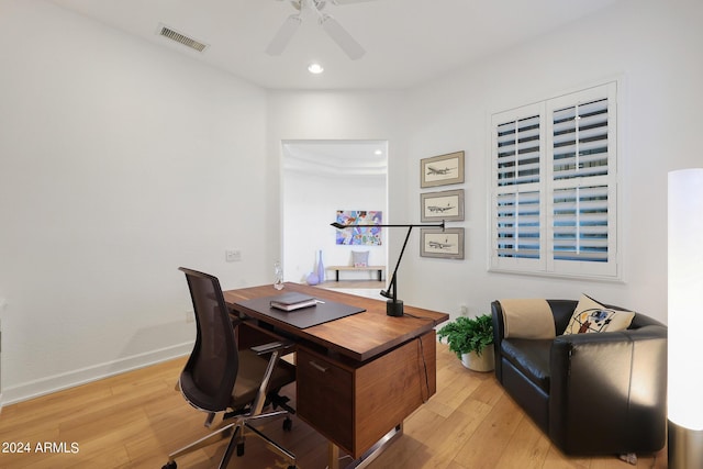 office featuring light wood-type flooring and ceiling fan