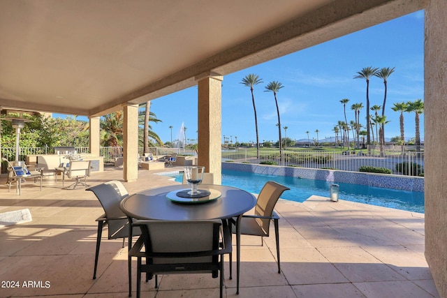 view of patio with a water view