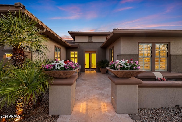 patio terrace at dusk with french doors