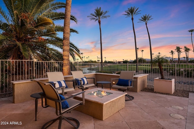 patio terrace at dusk with an outdoor fire pit