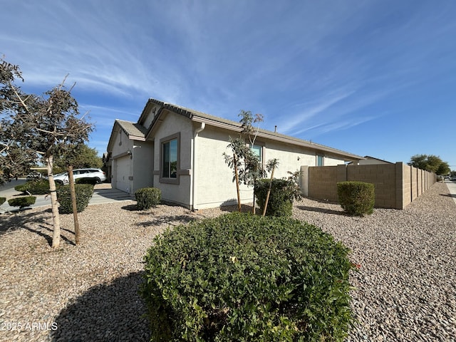 view of property exterior featuring a garage