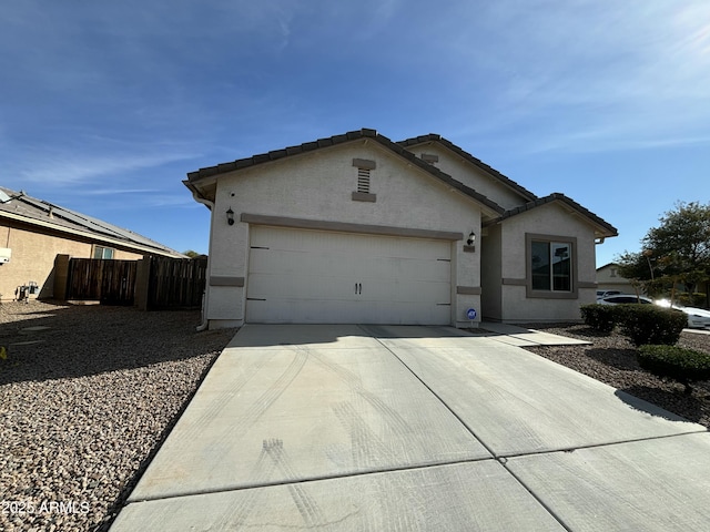 ranch-style house featuring a garage