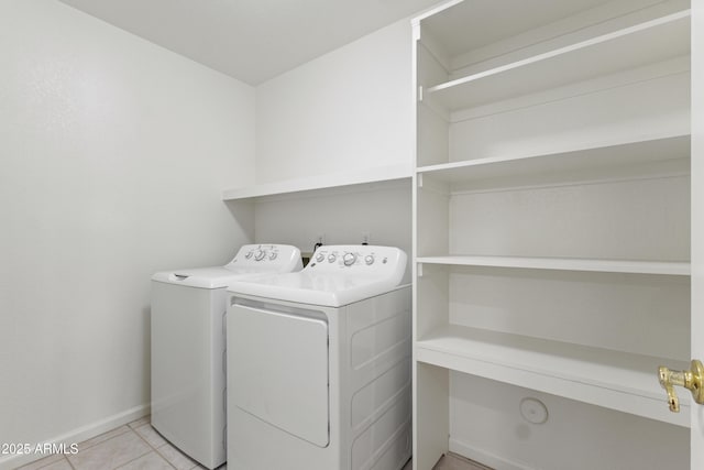 19010 N 35th Way, Phoenix, AZ 85050 - laundry room featuring washer and clothes dryer, baseboards, and light tile patterned floors