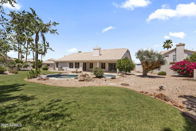 19010 N 35th Way, Phoenix, AZ 85050 - rear view of house featuring a tile roof, a lawn, a chimney, an outdoor pool, and a patio area