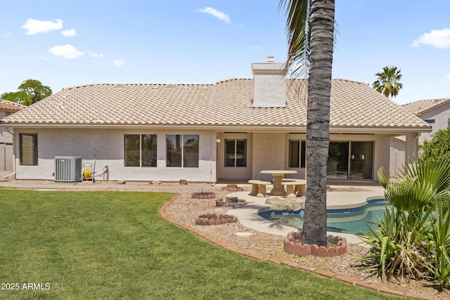 19010 N 35th Way, Phoenix, AZ 85050 - rear view of property with a chimney, a tile roof, central AC, and stucco siding
