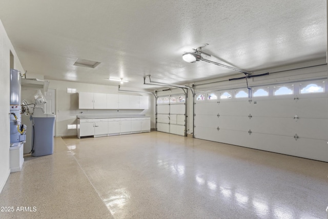 19010 N 35th Way, Phoenix, AZ 85050 - garage with a garage door opener and washer / dryer