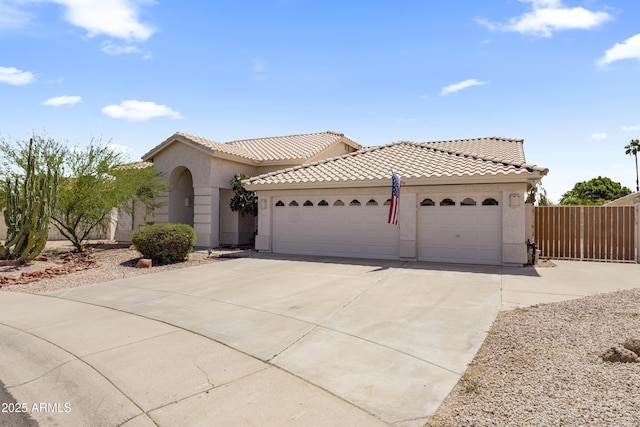19010 N 35th Way, Phoenix, AZ 85050 - mediterranean / spanish house with an attached garage, driveway, stucco siding, and a tiled roof