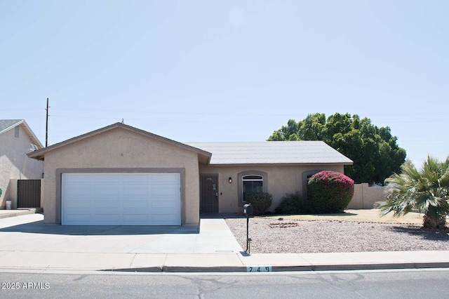 749 N 99th St, Mesa, AZ 85207 - ranch-style house featuring driveway, a garage, stucco siding, and fence