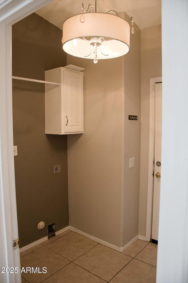 749 N 99th St, Mesa, AZ 85207 - clothes washing area with cabinet space, light tile patterned floors, baseboards, and hookup for an electric dryer