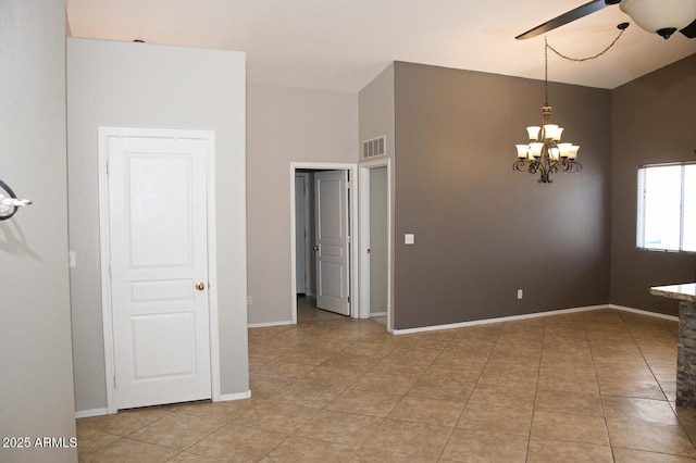 749 N 99th St, Mesa, AZ 85207 - spare room with a ceiling fan, a chandelier, light tile patterned flooring, and baseboards
