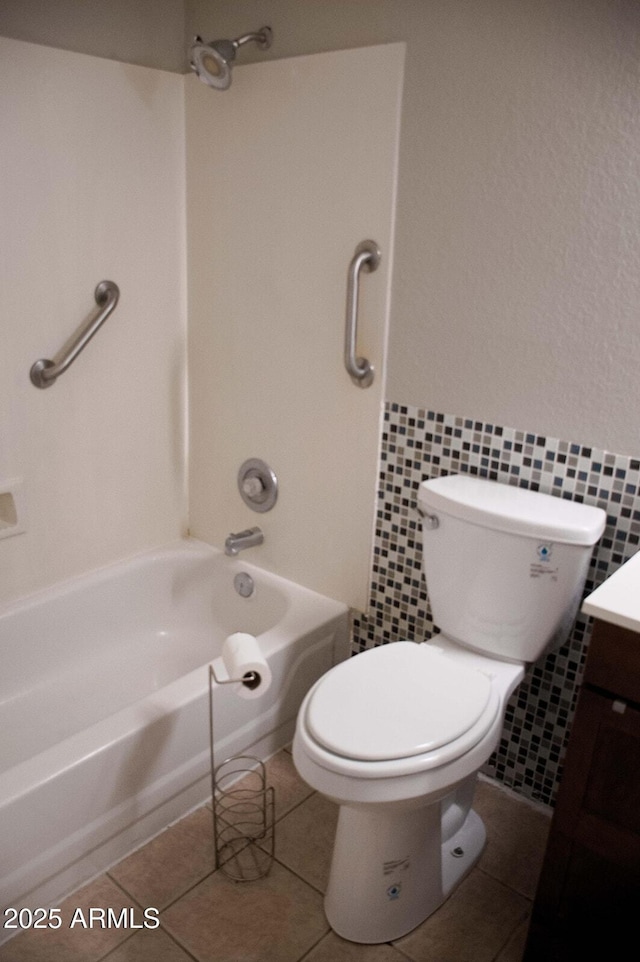 749 N 99th St, Mesa, AZ 85207 - bathroom with vanity, toilet, wainscoting, shower / tub combination, and tile walls