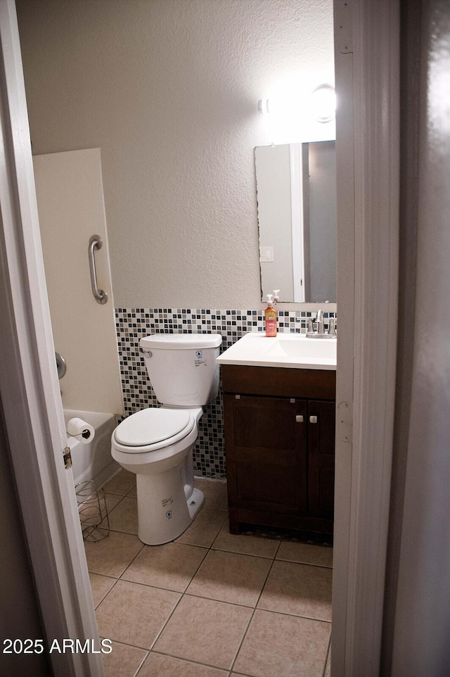 749 N 99th St, Mesa, AZ 85207 - bathroom featuring tile patterned flooring, vanity, tile walls, and toilet