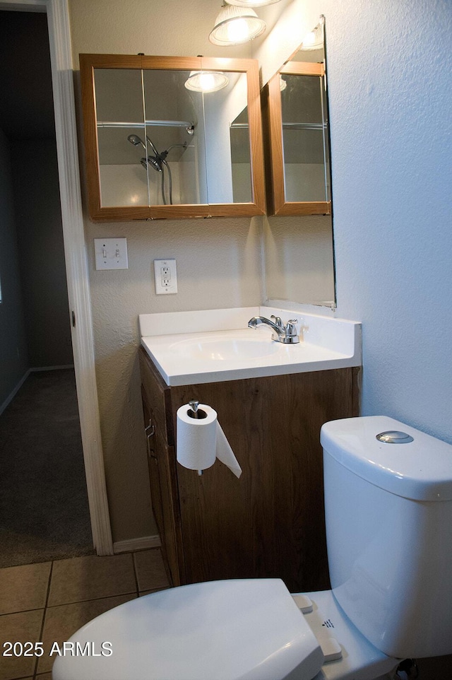 749 N 99th St, Mesa, AZ 85207 - bathroom with toilet, tile patterned flooring, and vanity