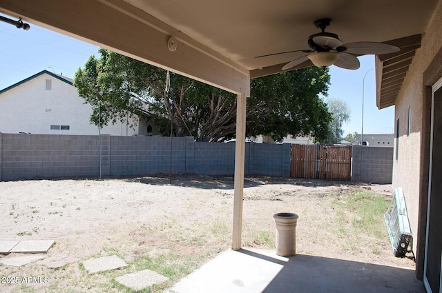 749 N 99th St, Mesa, AZ 85207 - fenced backyard featuring ceiling fan, a patio area, and a gate