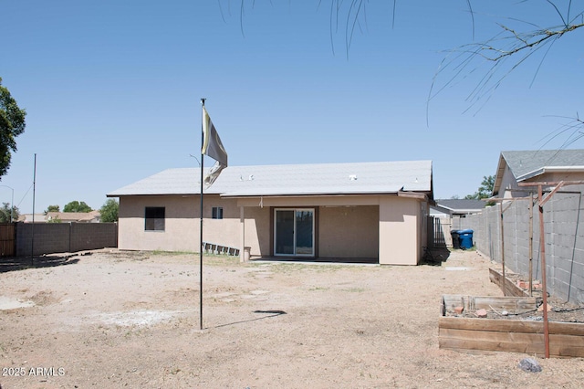 749 N 99th St, Mesa, AZ 85207 - rear view of property with stucco siding, a fenced backyard, and a vegetable garden