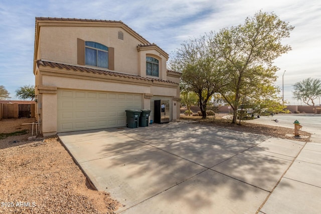 back of property with a garage