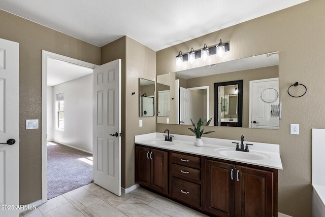 1125 E San Carlos Way, Chandler, AZ 85249 - full bathroom with double vanity and marble look tiles