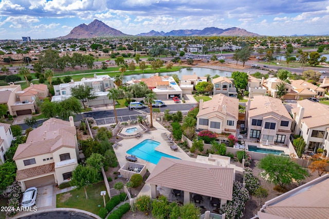 bird's eye view with a water and mountain view