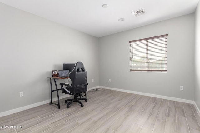 office space with light hardwood / wood-style floors