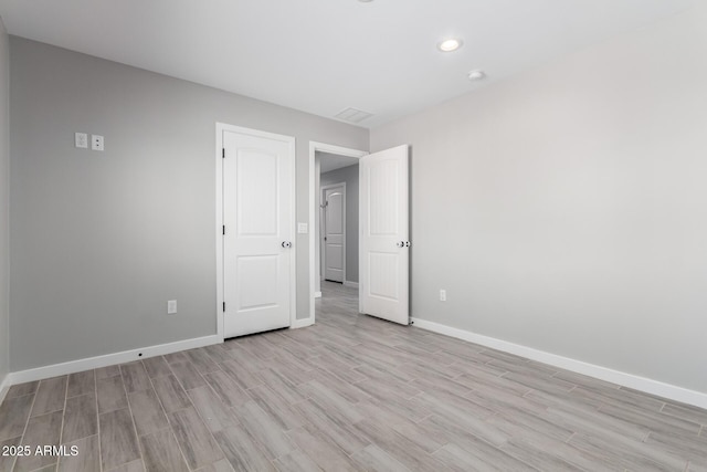 unfurnished bedroom featuring light hardwood / wood-style floors