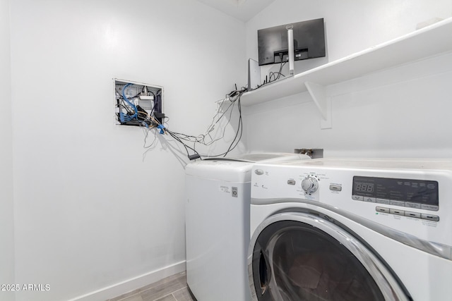 washroom featuring washer and dryer