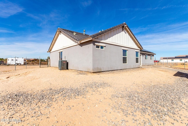 back of property with central air condition unit