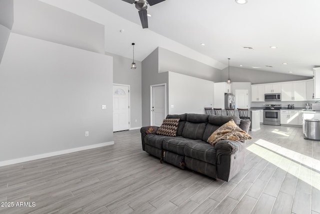 living room featuring vaulted ceiling