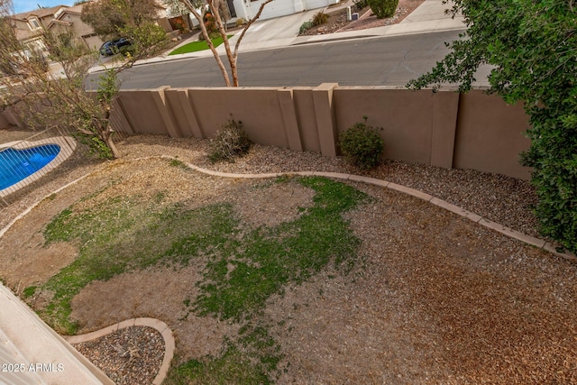 view of yard featuring a fenced backyard