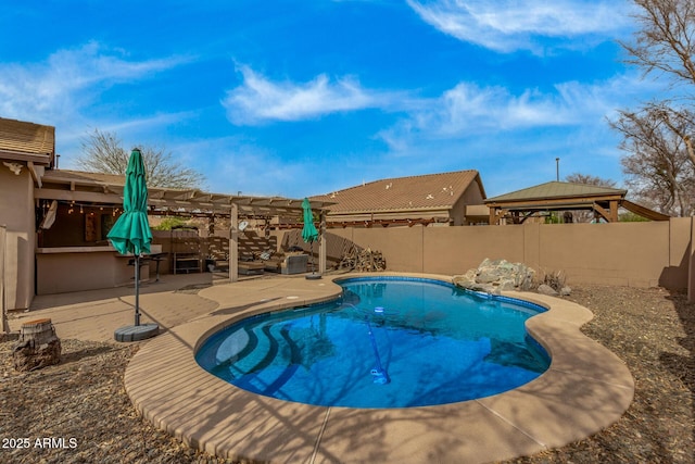 view of pool with a patio area, a fenced backyard, a fenced in pool, and a pergola