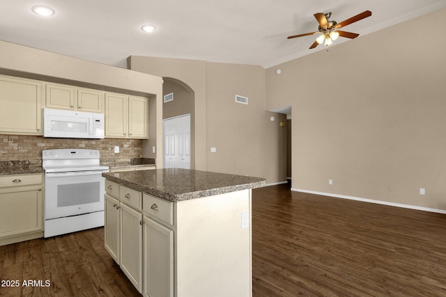 kitchen featuring ceiling fan, visible vents, arched walkways, lofted ceiling, and white appliances