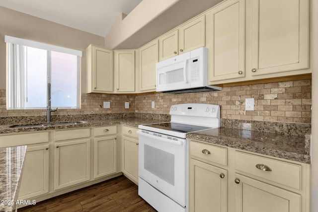 kitchen featuring white appliances, dark wood-style flooring, decorative backsplash, and a sink