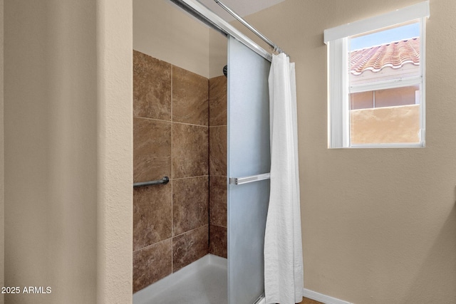 bathroom featuring a stall shower