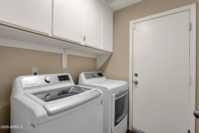 laundry area with cabinet space and washing machine and dryer