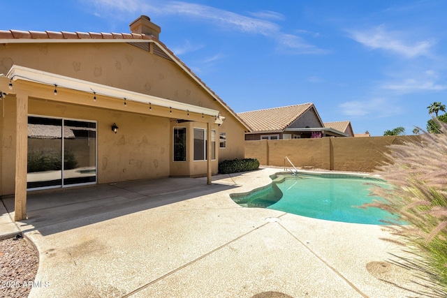 view of swimming pool with a patio, a fenced backyard, and a fenced in pool