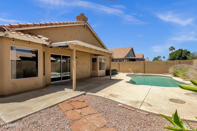 view of pool featuring a patio, a fenced backyard, and a fenced in pool