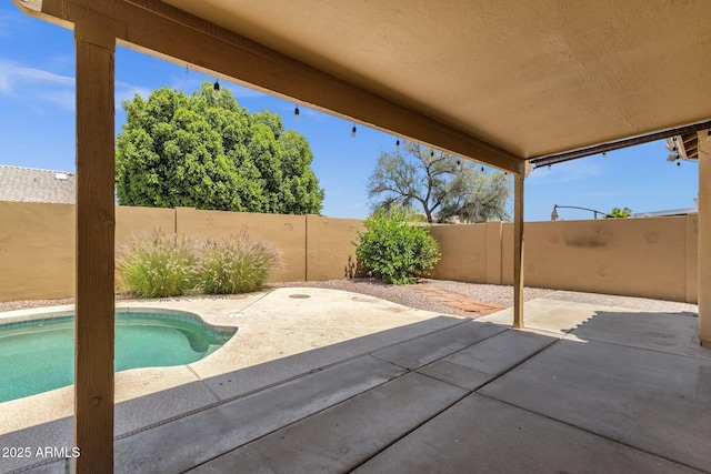 view of patio with a fenced backyard and a fenced in pool