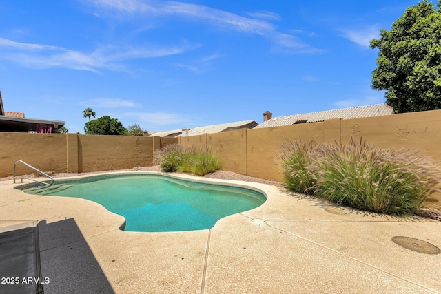 view of pool with a fenced in pool, a fenced backyard, and a patio