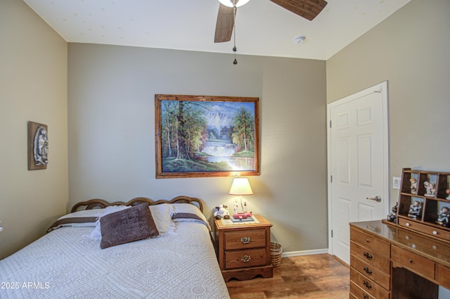 bedroom with wood-type flooring and ceiling fan