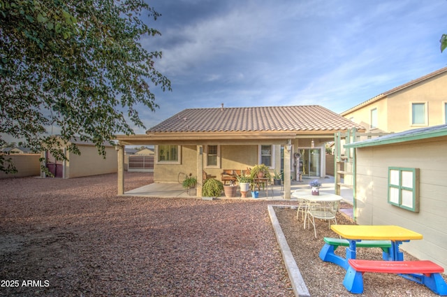 back of house with a patio area