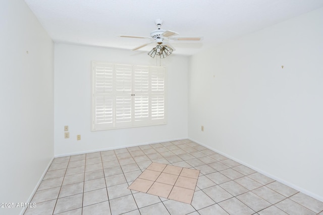 unfurnished room featuring ceiling fan and light tile patterned flooring