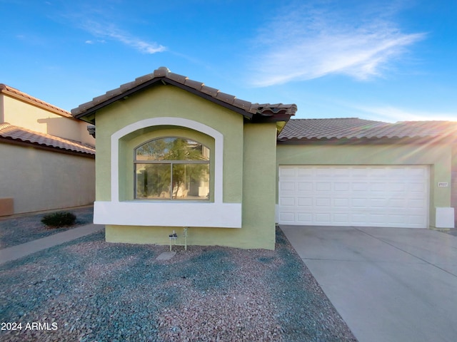 view of front of property with a garage