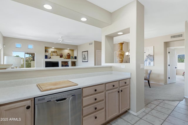 kitchen with visible vents, plenty of natural light, dishwasher, and light brown cabinets