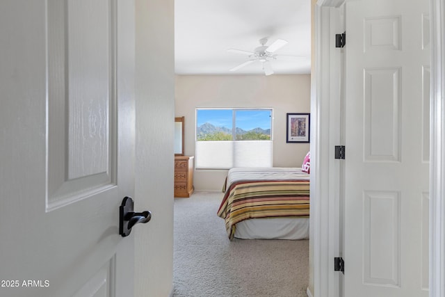 carpeted bedroom featuring a ceiling fan