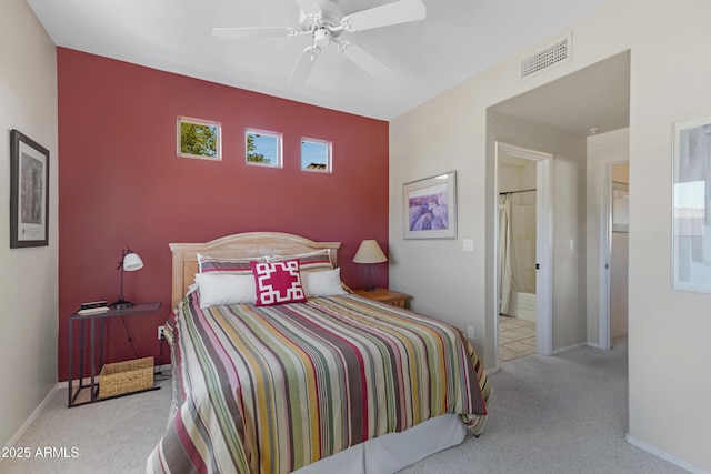 carpeted bedroom featuring visible vents, ceiling fan, and baseboards